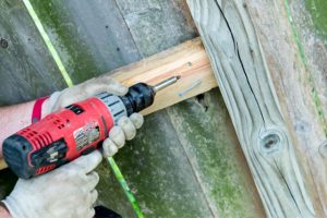 Fence Repair in Salem by worker