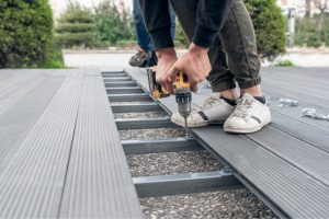 Worker Installing Composite Deck in Salem