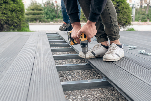 Worker Installing Composite Deck in Salem