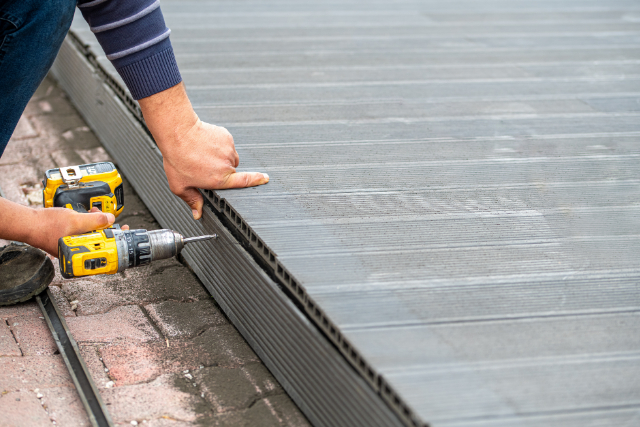 Salem worker installing composite deck