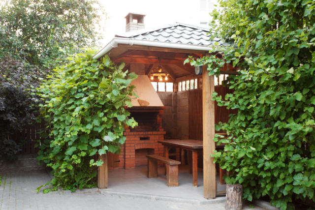 Salem Wooden Gazebo with firepit and eating bench and table