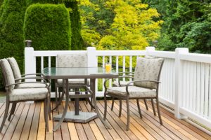 Salem residential cedar wood deck with a lot of greenery around the yard